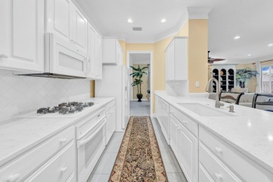 Experience coastal luxury at Sunshine Retreat nestled in the on Regatta Bay Golf and Country Club in Florida - for sale on GolfHomes.com, golf home, golf lot