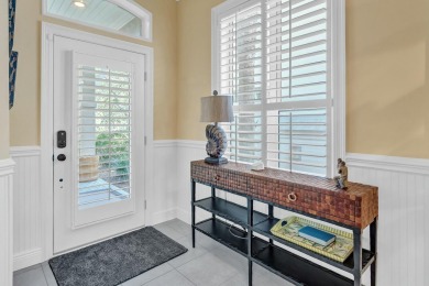 Experience coastal luxury at Sunshine Retreat nestled in the on Regatta Bay Golf and Country Club in Florida - for sale on GolfHomes.com, golf home, golf lot