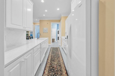 Experience coastal luxury at Sunshine Retreat nestled in the on Regatta Bay Golf and Country Club in Florida - for sale on GolfHomes.com, golf home, golf lot