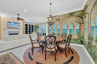 Experience coastal luxury at Sunshine Retreat nestled in the on Regatta Bay Golf and Country Club in Florida - for sale on GolfHomes.com, golf home, golf lot