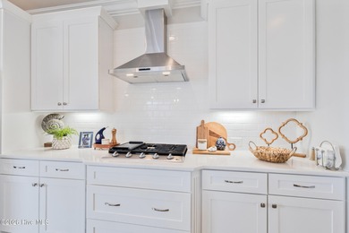 Luxury, views, and location -- this stunning end-unit elevator on Sea Trail Golf Resort in North Carolina - for sale on GolfHomes.com, golf home, golf lot