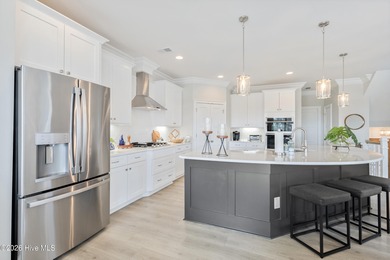 Luxury, views, and location -- this stunning end-unit elevator on Sea Trail Golf Resort in North Carolina - for sale on GolfHomes.com, golf home, golf lot