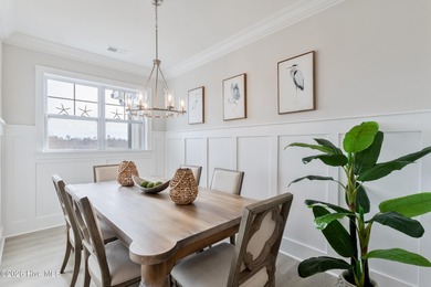 Luxury, views, and location -- this stunning end-unit elevator on Sea Trail Golf Resort in North Carolina - for sale on GolfHomes.com, golf home, golf lot