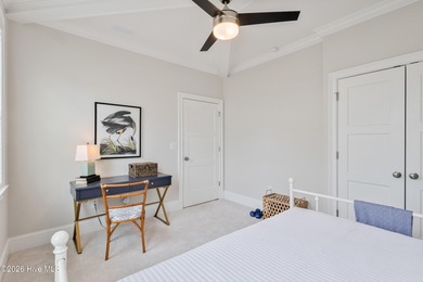 Luxury, views, and location -- this stunning end-unit elevator on Sea Trail Golf Resort in North Carolina - for sale on GolfHomes.com, golf home, golf lot