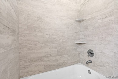 Enjoy the difference that award-winning quality makes in this on Citrus Springs Country Club in Florida - for sale on GolfHomes.com, golf home, golf lot