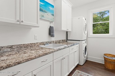 Refined coastal living in the resort-style and vibrant community on Members Club At St. James Plantation in North Carolina - for sale on GolfHomes.com, golf home, golf lot