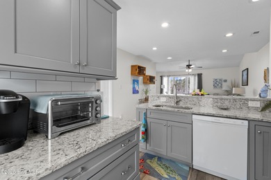 Welcome home to 7212 Windward Drive inside of the immaculate on Harbour Point Golf Club in North Carolina - for sale on GolfHomes.com, golf home, golf lot