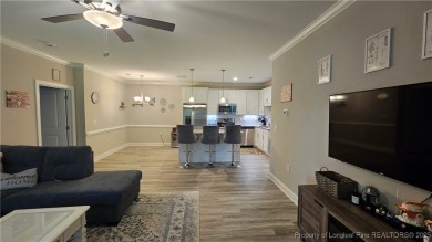This luxury condo in Fairway Pointe in Anderson Creek Club is on Anderson Creek Golf Club in North Carolina - for sale on GolfHomes.com, golf home, golf lot