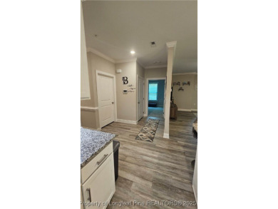 This luxury condo in Fairway Pointe in Anderson Creek Club is on Anderson Creek Golf Club in North Carolina - for sale on GolfHomes.com, golf home, golf lot
