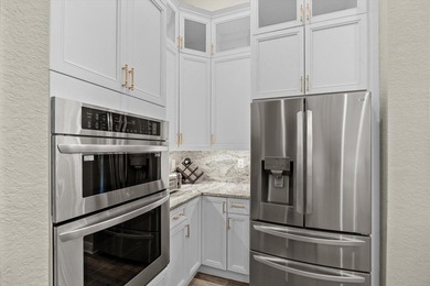 Experience luxury and privacy in this stunning home set on .67 on The Cape Club of Palm City in Florida - for sale on GolfHomes.com, golf home, golf lot