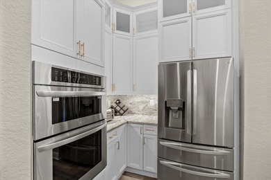 Experience luxury and privacy in this stunning home set on .67 on The Cape Club of Palm City in Florida - for sale on GolfHomes.com, golf home, golf lot