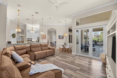 Experience luxury and privacy in this stunning home set on .67 on The Cape Club of Palm City in Florida - for sale on GolfHomes.com, golf home, golf lot