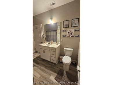 This luxury condo in Fairway Pointe in Anderson Creek Club is on Anderson Creek Golf Club in North Carolina - for sale on GolfHomes.com, golf home, golf lot