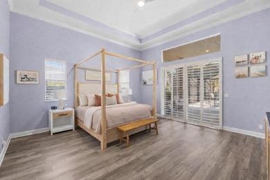 Experience luxury and privacy in this stunning home set on .67 on The Cape Club of Palm City in Florida - for sale on GolfHomes.com, golf home, golf lot