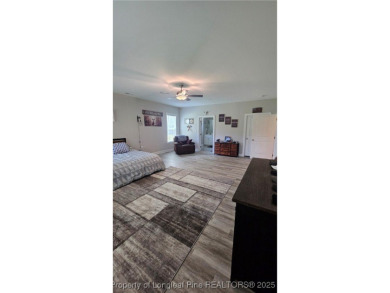 This luxury condo in Fairway Pointe in Anderson Creek Club is on Anderson Creek Golf Club in North Carolina - for sale on GolfHomes.com, golf home, golf lot