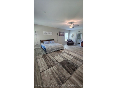 This luxury condo in Fairway Pointe in Anderson Creek Club is on Anderson Creek Golf Club in North Carolina - for sale on GolfHomes.com, golf home, golf lot