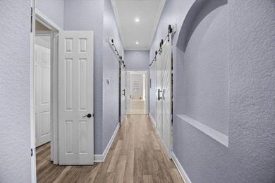 Experience luxury and privacy in this stunning home set on .67 on The Cape Club of Palm City in Florida - for sale on GolfHomes.com, golf home, golf lot