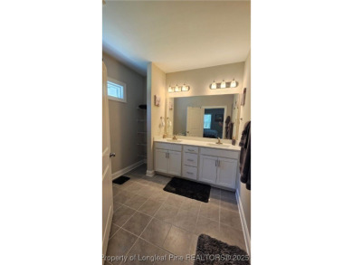 This luxury condo in Fairway Pointe in Anderson Creek Club is on Anderson Creek Golf Club in North Carolina - for sale on GolfHomes.com, golf home, golf lot