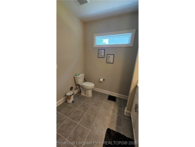 This luxury condo in Fairway Pointe in Anderson Creek Club is on Anderson Creek Golf Club in North Carolina - for sale on GolfHomes.com, golf home, golf lot