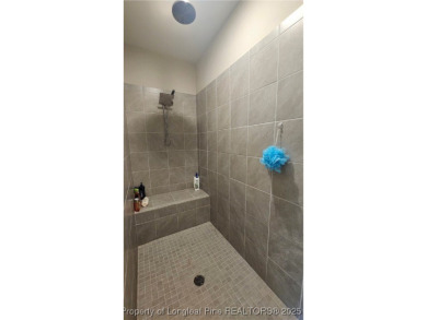 This luxury condo in Fairway Pointe in Anderson Creek Club is on Anderson Creek Golf Club in North Carolina - for sale on GolfHomes.com, golf home, golf lot