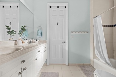 Experience luxury and privacy in this stunning home set on .67 on The Cape Club of Palm City in Florida - for sale on GolfHomes.com, golf home, golf lot