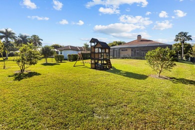 Experience luxury and privacy in this stunning home set on .67 on The Cape Club of Palm City in Florida - for sale on GolfHomes.com, golf home, golf lot