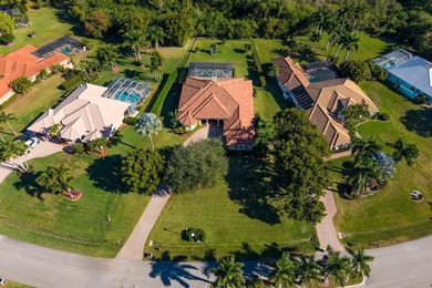 Experience luxury and privacy in this stunning home set on .67 on The Cape Club of Palm City in Florida - for sale on GolfHomes.com, golf home, golf lot