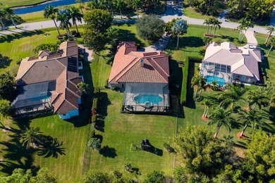 Experience luxury and privacy in this stunning home set on .67 on The Cape Club of Palm City in Florida - for sale on GolfHomes.com, golf home, golf lot