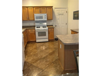 This 2-bedroom, 2-bath Austin Model home is located in the on Glenview Championship Golf and Country Club in Florida - for sale on GolfHomes.com, golf home, golf lot
