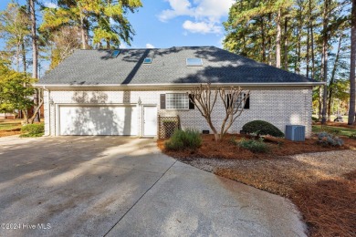 Welcome to this custom 4-bedroom, 3-bathroom golf course home on Cypress Landing Golf Club in North Carolina - for sale on GolfHomes.com, golf home, golf lot