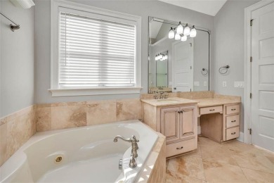 Absolutely Stunning! From the moment you walk in the travertine on Oak Grove Island Golf and Country Club in Georgia - for sale on GolfHomes.com, golf home, golf lot