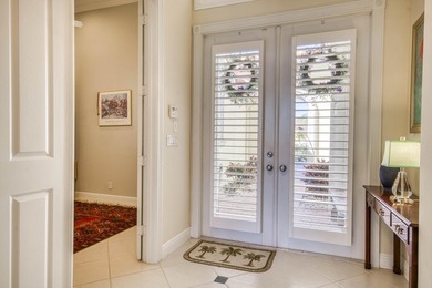 Expansive southern lake and golf views highlight this on Ironhorse Country Club in Florida - for sale on GolfHomes.com, golf home, golf lot