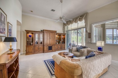 Expansive southern lake and golf views highlight this on Ironhorse Country Club in Florida - for sale on GolfHomes.com, golf home, golf lot