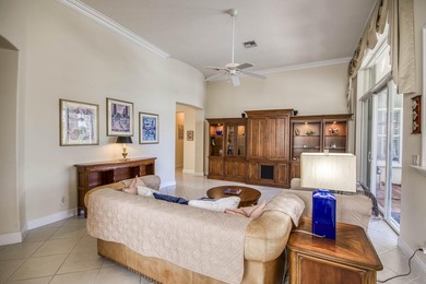 Expansive southern lake and golf views highlight this on Ironhorse Country Club in Florida - for sale on GolfHomes.com, golf home, golf lot