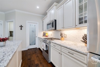 This exceptional Savannah Quarters home on the 7th fairway truly on Savannah Quarters Country Club in Georgia - for sale on GolfHomes.com, golf home, golf lot