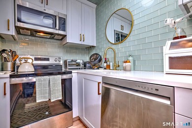 Wake up to peaceful golf and water views in this charming on Short Beach Golf Course in Connecticut - for sale on GolfHomes.com, golf home, golf lot