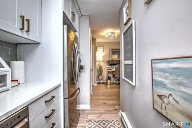 Wake up to peaceful golf and water views in this charming on Short Beach Golf Course in Connecticut - for sale on GolfHomes.com, golf home, golf lot