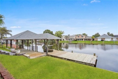 Beautifully designed home in a gated waterfront golf community on Oak Harbor Golf Club in Louisiana - for sale on GolfHomes.com, golf home, golf lot