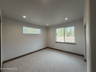 Located in a gated community in Blanchard, Idaho, this 2,252 sq on Stoneridge Golf Club in Idaho - for sale on GolfHomes.com, golf home, golf lot