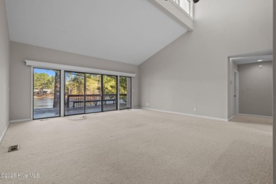 Welcome to this quaint waterfront and golf view Condo. Enjoy on Whispering Pines Golf Course in North Carolina - for sale on GolfHomes.com, golf home, golf lot