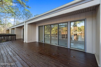 Welcome to this quaint waterfront and golf view Condo. Enjoy on Whispering Pines Golf Course in North Carolina - for sale on GolfHomes.com, golf home, golf lot