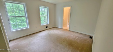 Tucked away on over an acre of wooded privacy, this 5-bedroom on Great Bear Golf and Country Club in Pennsylvania - for sale on GolfHomes.com, golf home, golf lot