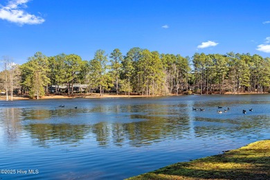 Welcome to this quaint waterfront and golf view Condo. Enjoy on Whispering Pines Golf Course in North Carolina - for sale on GolfHomes.com, golf home, golf lot