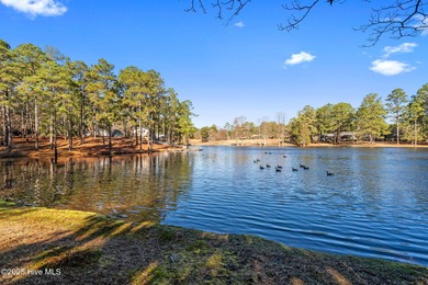 Welcome to this quaint waterfront and golf view Condo. Enjoy on Whispering Pines Golf Course in North Carolina - for sale on GolfHomes.com, golf home, golf lot