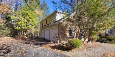 Tucked away on over an acre of wooded privacy, this 5-bedroom on Great Bear Golf and Country Club in Pennsylvania - for sale on GolfHomes.com, golf home, golf lot