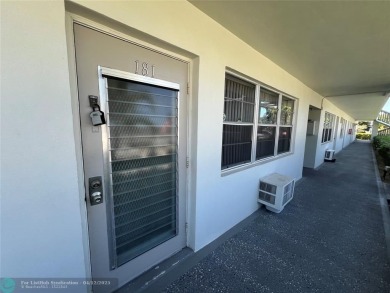 ENJOY THE CONVENIENCE OF FIRST FLOOR LIVING IN THIS ONE BEDROOM on Hillsboro Pines Golf in Florida - for sale on GolfHomes.com, golf home, golf lot