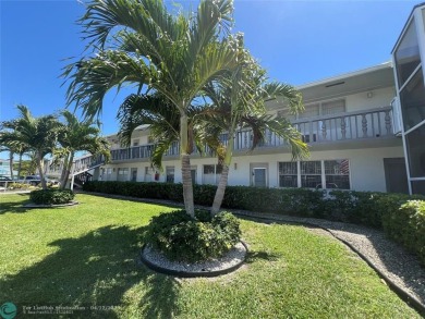 ENJOY THE CONVENIENCE OF FIRST FLOOR LIVING IN THIS ONE BEDROOM on Hillsboro Pines Golf in Florida - for sale on GolfHomes.com, golf home, golf lot
