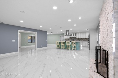 Beautifully updated all brick home nestled on 2.09 acres. 3 Bed on Palm Valley Golf Club in Florida - for sale on GolfHomes.com, golf home, golf lot