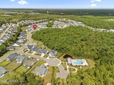 Discover this charming 3-bedroom, 3-bathroom home in the on Olde Point Golf and Country Club in North Carolina - for sale on GolfHomes.com, golf home, golf lot