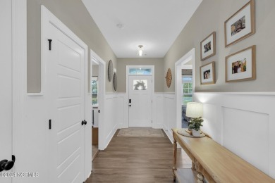 Discover this charming 3-bedroom, 3-bathroom home in the on Olde Point Golf and Country Club in North Carolina - for sale on GolfHomes.com, golf home, golf lot